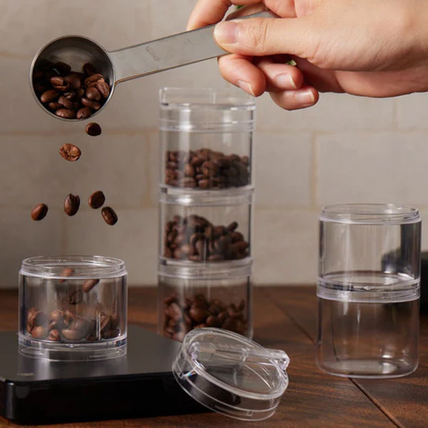 ANKOMN QuarterSeal X7 modular single‑dose coffee organizer—clear plastic with twist‑to‑seal lid