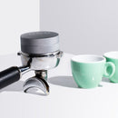 Nucleus coffee distribution tool  in a portafilter basket